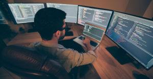 Developer workstation showing multiple coding environments reflecting growing open-source dependency complexity in AI-assisted development
